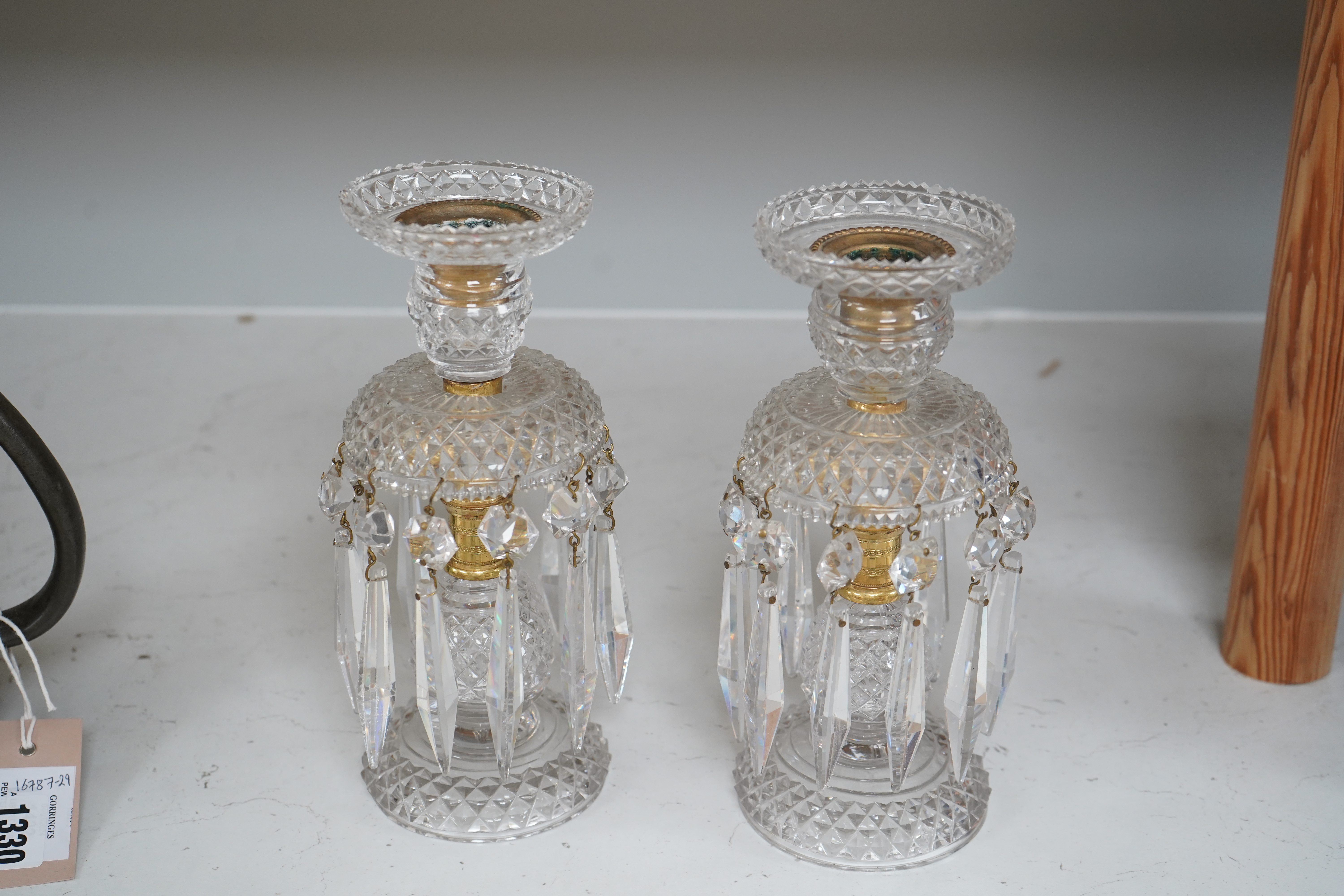 A pair of Victorian cut glass and gilt metal table lustres, 21.5cm. Condition- minor nicks